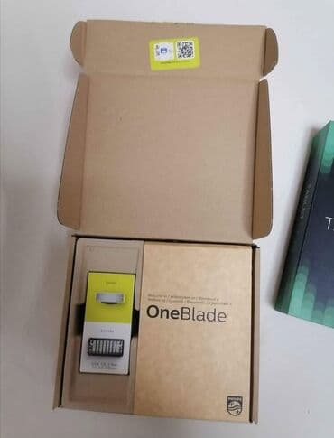 aplikator za sociva cena: Philips OneBlade trimer u crnoj boji sa žutim akcentima, dizajniran za — 2