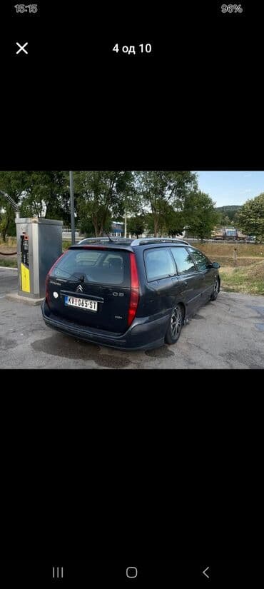 Citroen C5 karavan u tamnosivoj boji, sa krovnim nosačima i alu — 4