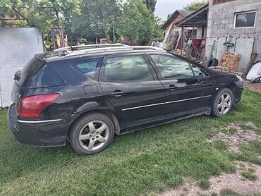 auto otpad audi sabac: Peugeot 407 SW karavan u crnoj boji. Vozilo ima krovne nosače i alu — 4