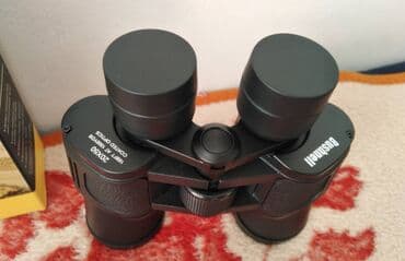 Dvogledi i teleskopi: Dvogled Bushnell 20x50 Boja crna Futrola Krpica za ciscenje Cena 2800 — 5