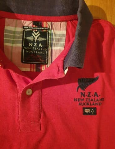 majica s: NZA NEW ZEALAND Auckland polo majica crvena sa kragnicom. L velicina — 1