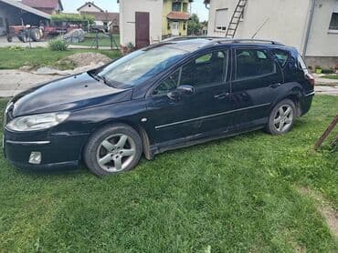 auto otpad audi sabac: Peugeot 407 SW karavan u crnoj boji. Vozilo ima krovne nosače i alu — 2