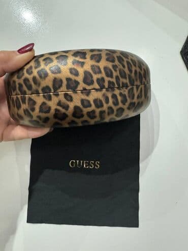 satovi guess: Guess — 2
