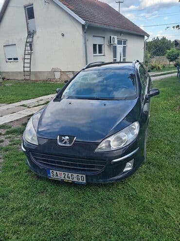 auto otpad audi sabac: Peugeot 407 SW karavan u crnoj boji. Vozilo ima krovne nosače i alu — 1