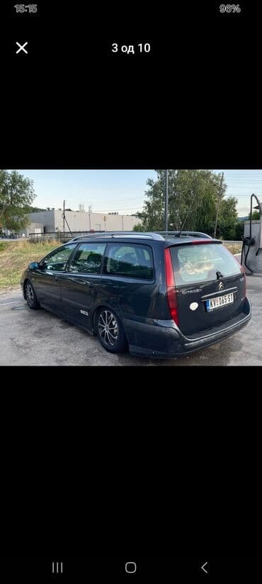 Citroen C5 karavan u tamnosivoj boji, sa krovnim nosačima i alu — 5