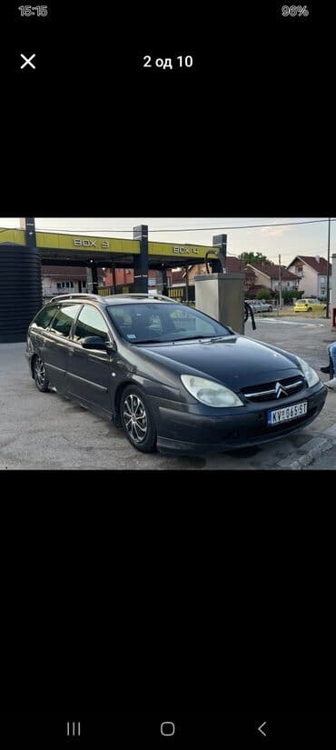 Citroen C5 karavan u tamnosivoj boji, sa krovnim nosačima i alu — 6