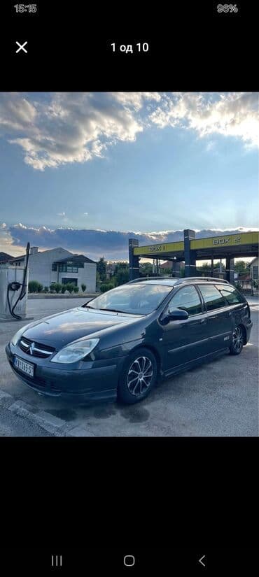 Citroen C5 karavan u tamnosivoj boji, sa krovnim nosačima i alu — 7