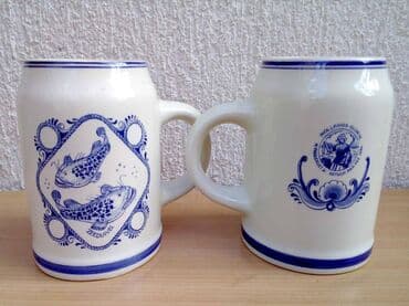stari satovi prodaja: 2 DELFT krigle 2 Delft krigle rukom oslikane Visina 13 cm, prečnik — 2